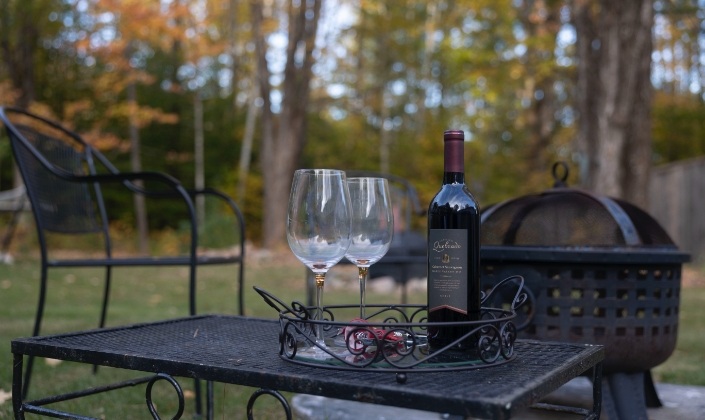 Wine and glasses on outdoor table
