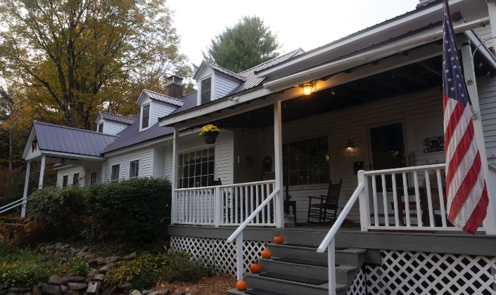 Buttonwood Inn on Mt Surprise porch decorated with pumpkins for fall