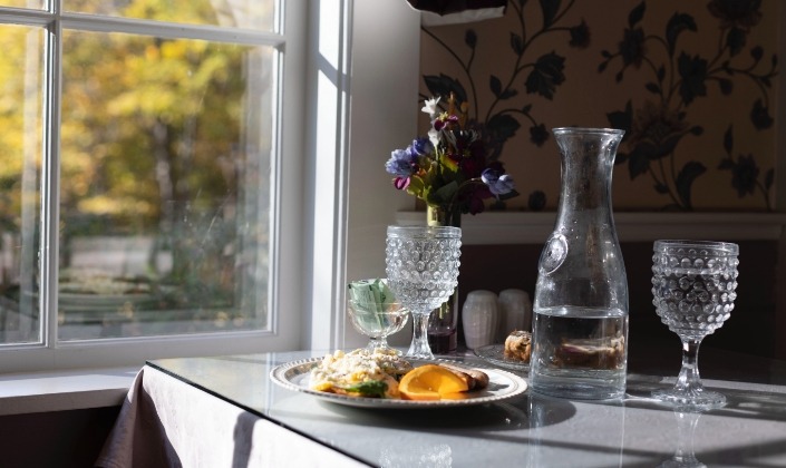 Breakfast table with view of fall trees out the window