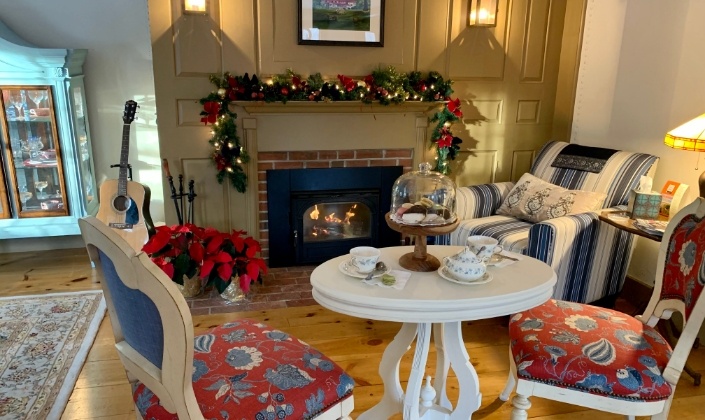 Chairs around a fireplace for afternoon tea