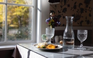 Food and spring water on dining room table