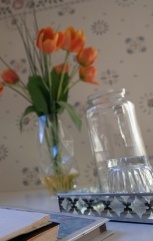 Vase of tulips on tabletop