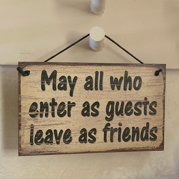 May all who enter as guests leave as friends sign