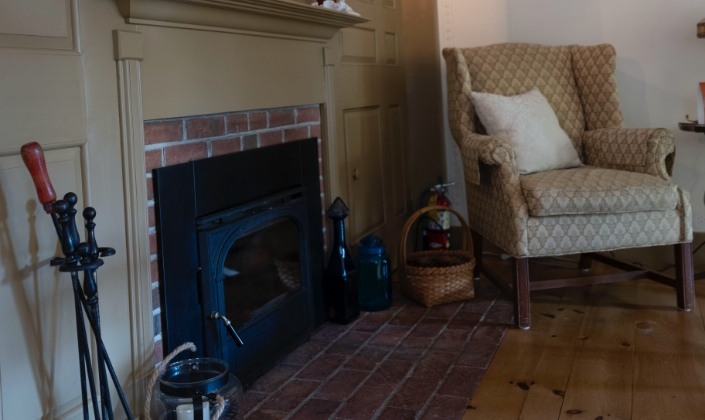 Fireplace and large chair in meeting room