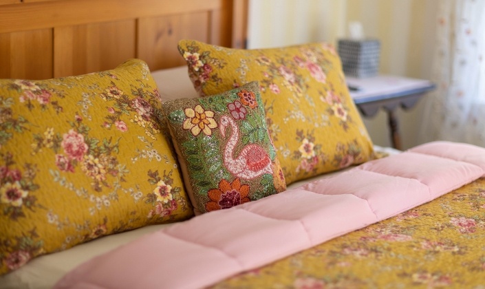 Decorative pillows on guest room bed
