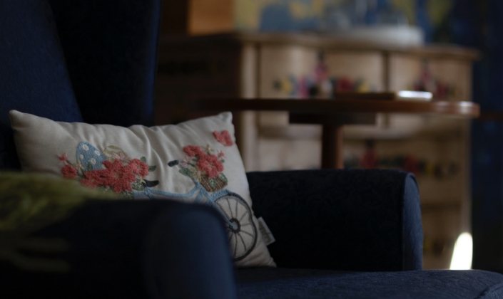 Cozy chair and pillow in guest room