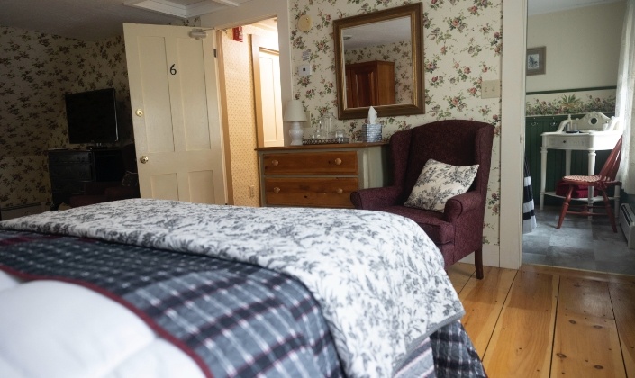 Looking into bathroom from bed