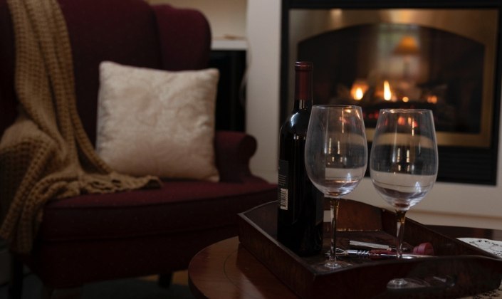 Bottle of wine and glasses in sitting room