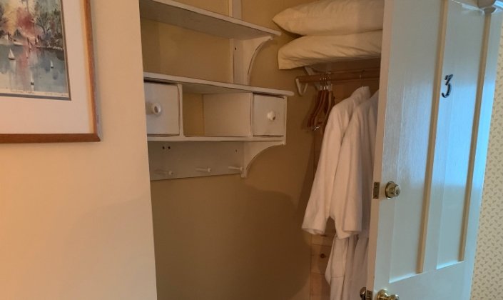 Closet and bath robes in guest room three