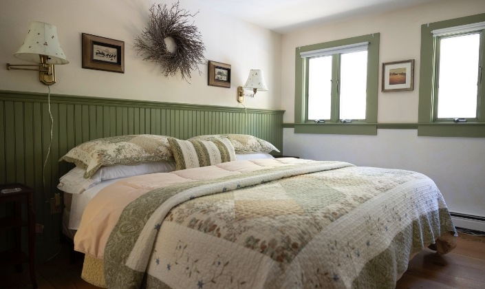 Bed with green quilt