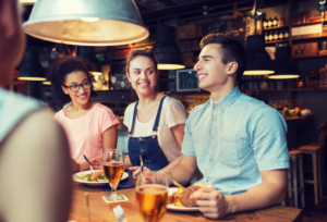 people enjoying food at a restaurant 