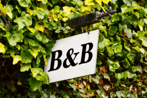 a close-up of a bed & breakfast sign