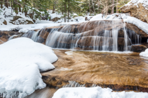 a wintery landscape and waterfall in North Conway